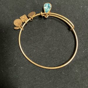 Gold Bangle Bracelet with Blue Charm